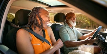 Seniors driving a car